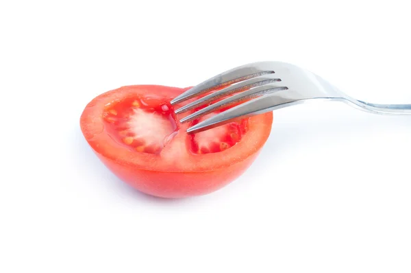 Fresh tomato on the fork — Stock Photo, Image