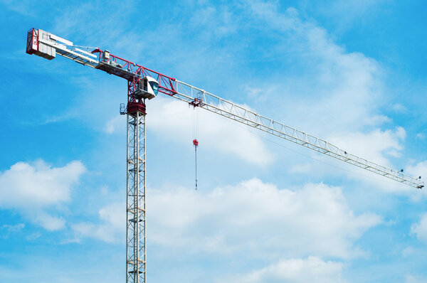Construction crane scene opposite blue sky
