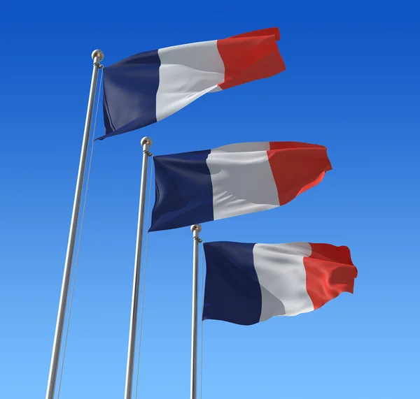 Flags of France against blue sky. — Stock Photo, Image