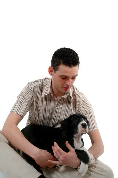 Young man looks at his dog — Stock Photo, Image