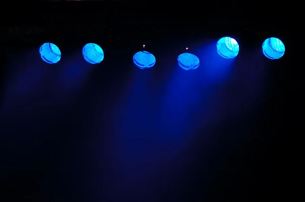 Blue spotlights and smoke — Stock Photo, Image