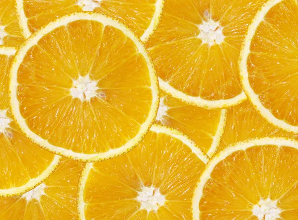 Fondo hecho de rodajas de naranja —  Fotos de Stock