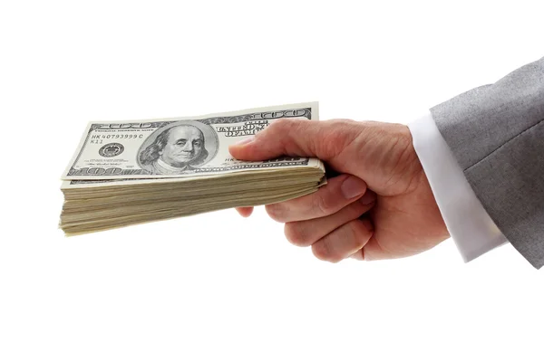Businessman holding pile of dollars — Stock Photo, Image