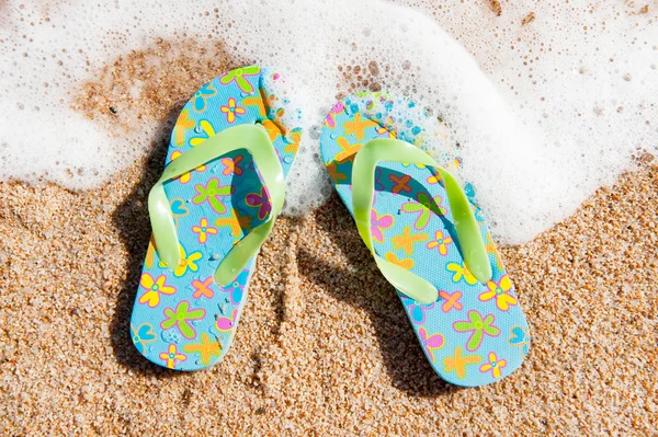 stock image Flip flops at the beach
