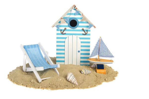 Beach hut with sailing boat and chair — Stock Photo, Image