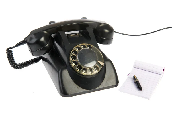 Teléfono negro vintage con bloc de notas — Foto de Stock