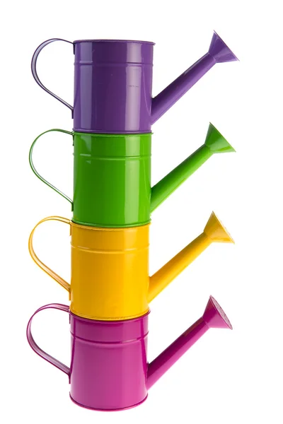 Colorful stacked watering cans — Stock Photo, Image