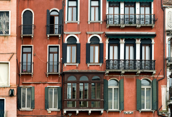 The rustic facade of an apartment building, Venice, Italy