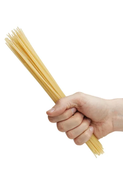 Die Hand des Mannes hält eine Handvoll Spaghetti. — Stockfoto