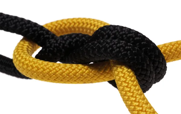 Double flat knot. black and yellow ropes. — Stock Photo, Image