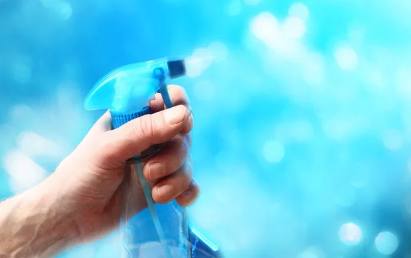 Hand with a spray. — Stock Photo, Image