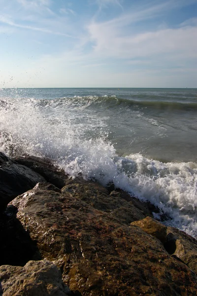 stock image waves and rocks on sea shore