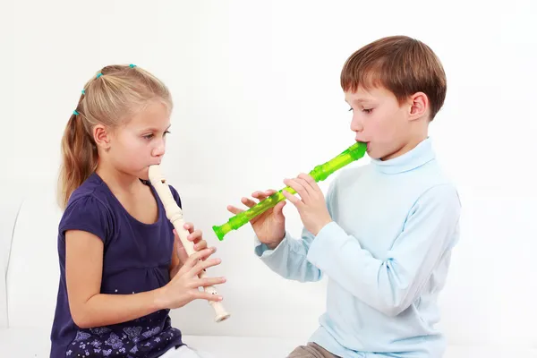 Kids playing flute — Stock Photo, Image