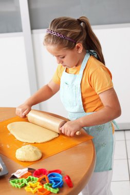 Child baking cookies clipart