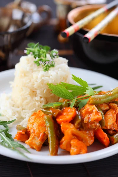 Red chicken curry stripes with rice — Stock Photo, Image