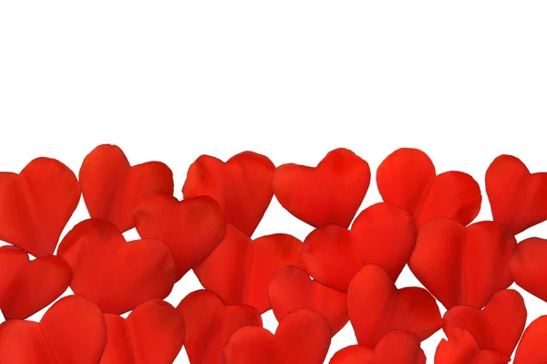 Petali a forma di cuore su sfondo bianco - cornice. Percorso di taglio incluso — Foto Stock