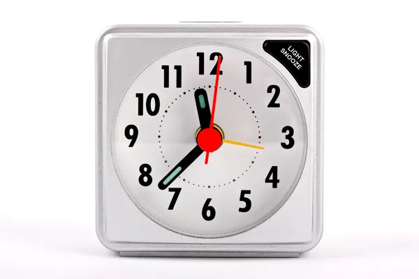 Relógio de alarme de viagem no fundo branco — Fotografia de Stock