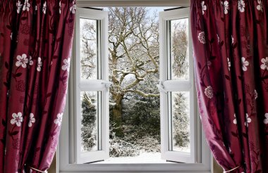 Open window with view to a snowy winter scene clipart