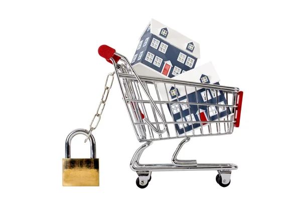 Houses in a trolley secured with chain and padlock — Stock Photo, Image