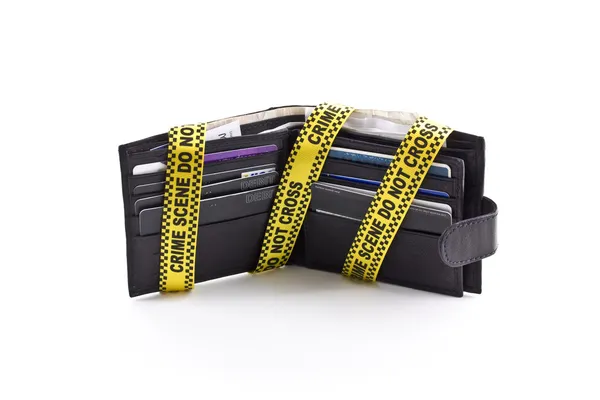 Wallet open with crime scene tape around it, isolated — Stock Photo, Image