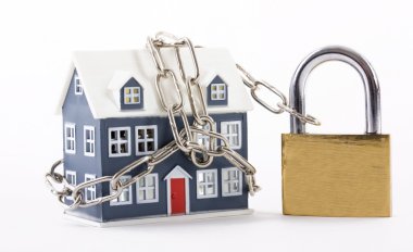 House secured with chain and padlock on a white background clipart