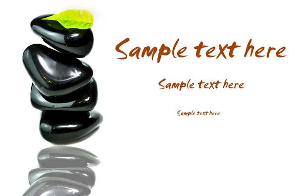 Stack od black spa stones — Stock Photo, Image