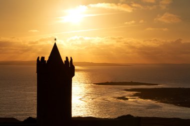 Doonagore castle at sunset clipart