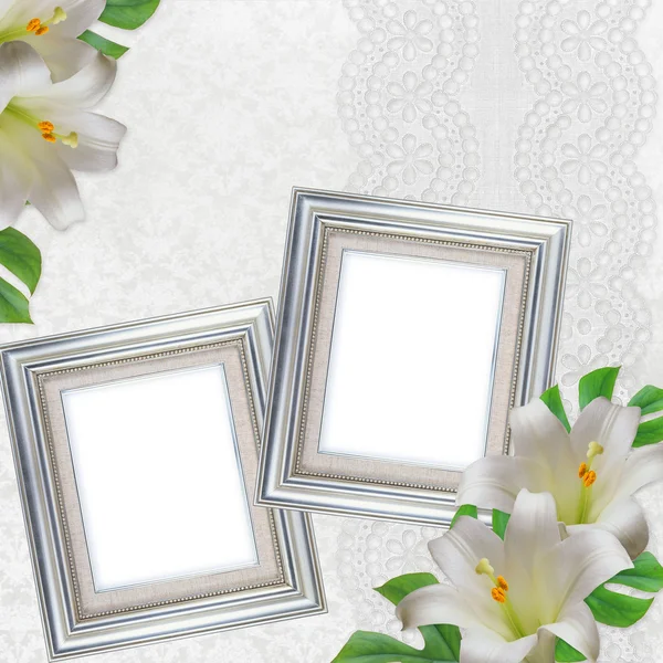 Lilies on white background with lace and 2 silver frames — Stock Photo, Image