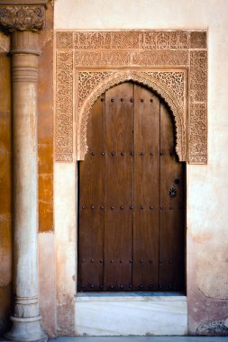 Ancient door of Alhambra Palace clipart