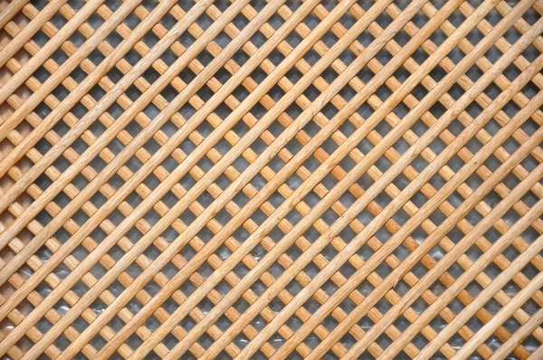 Wooden grid, the background of woven wood — Stock Photo, Image