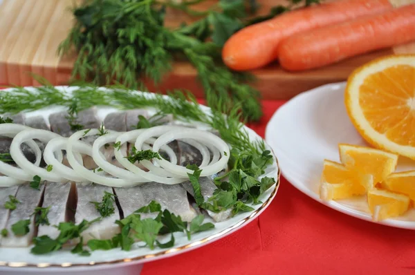 Appetizing herring with onions and oranges — Stock Photo, Image