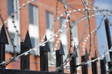 Barbed wire fence at the prison clipart