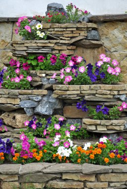 The stone flower bed on the wall clipart