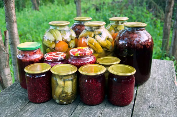 Home canning. Pickled vegetables and jam — Stock Photo, Image