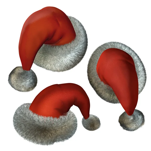 Trois chapeaux de Père Noël rouges sur blanc Photo De Stock