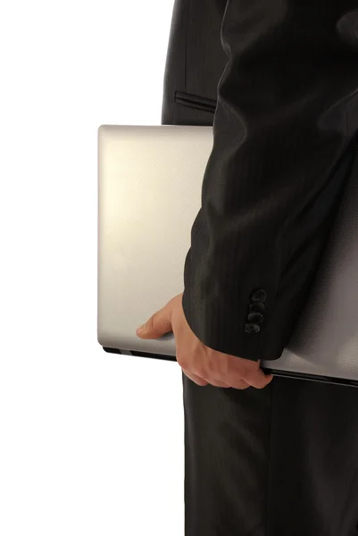 Empresario sosteniendo laptop- vista lateral —  Fotos de Stock