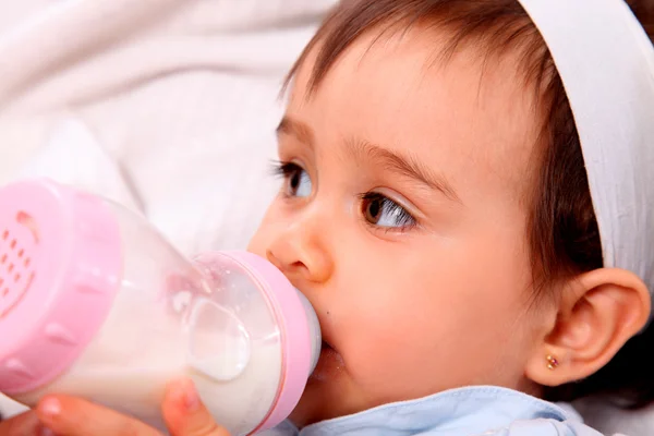 Baby girl with bottle — Stock Photo, Image
