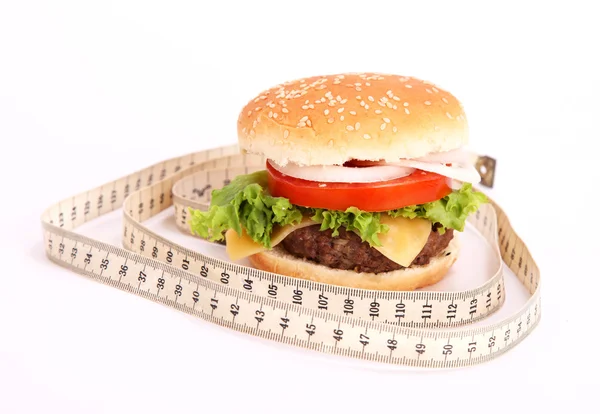 Hamburger ve ölçüm bandı — Stok fotoğraf