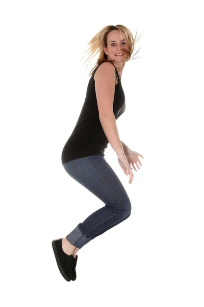 Csinos szőke lány jumping az öröm — Stock Fotó