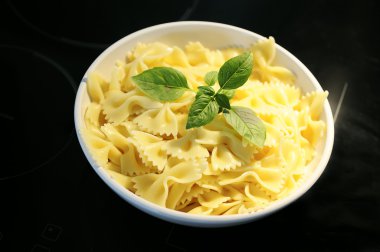 Farfalle pasta and basil clipart