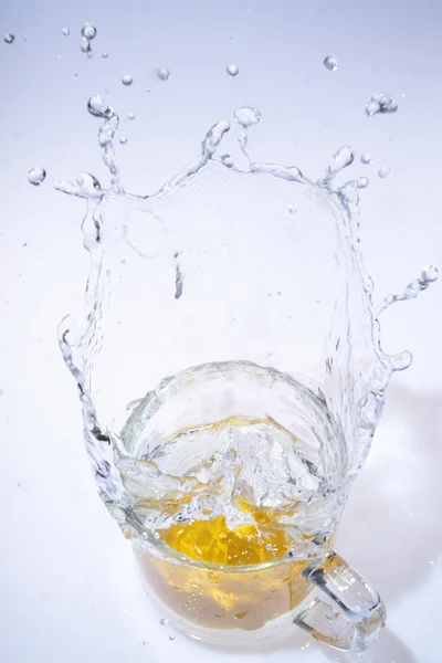 Fruit drop in water — Stock Photo, Image
