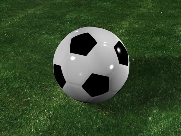 Un balón de fútbol en el grassplot  . Imagen de archivo
