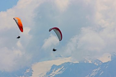 Hanggliding in swiss alps clipart