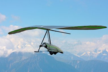 Hanggliding in swiss Alps clipart