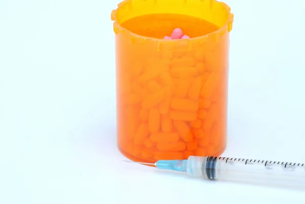 Hypodermic Needle and Prescription Drugs — Stock Photo, Image