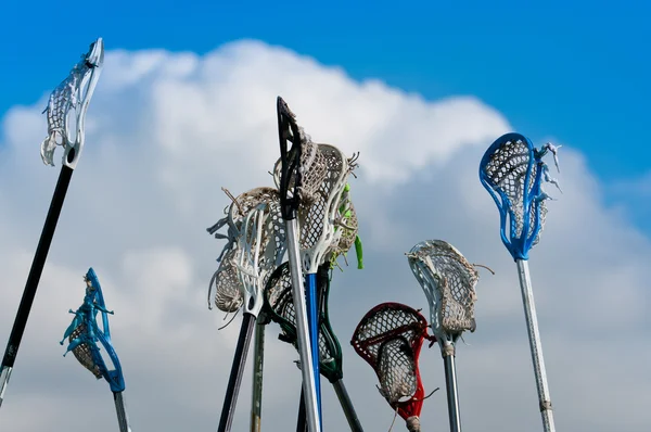 Lacrosse varas no céu — Fotografia de Stock