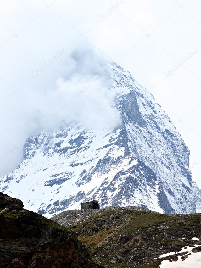 Single house in front of mountain Matterhorn