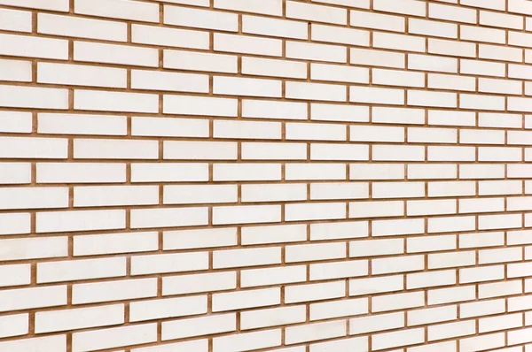 Beige gekleurde fijne bakstenen muur textuur achtergrond perspectief, la — Stockfoto