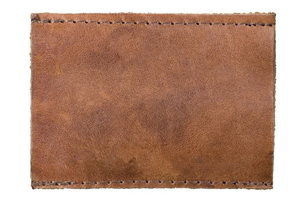 Lege natuurlijk leder etiket, geïsoleerde bruin jeans label — Stockfoto