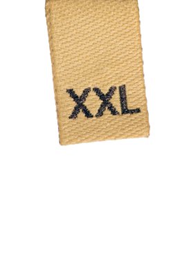 Macro of XXL size clothing label on white, isolated clipart